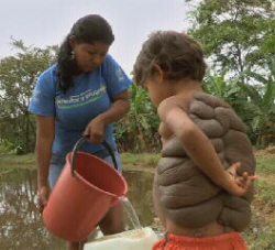 Luz and Didier Fetching Water